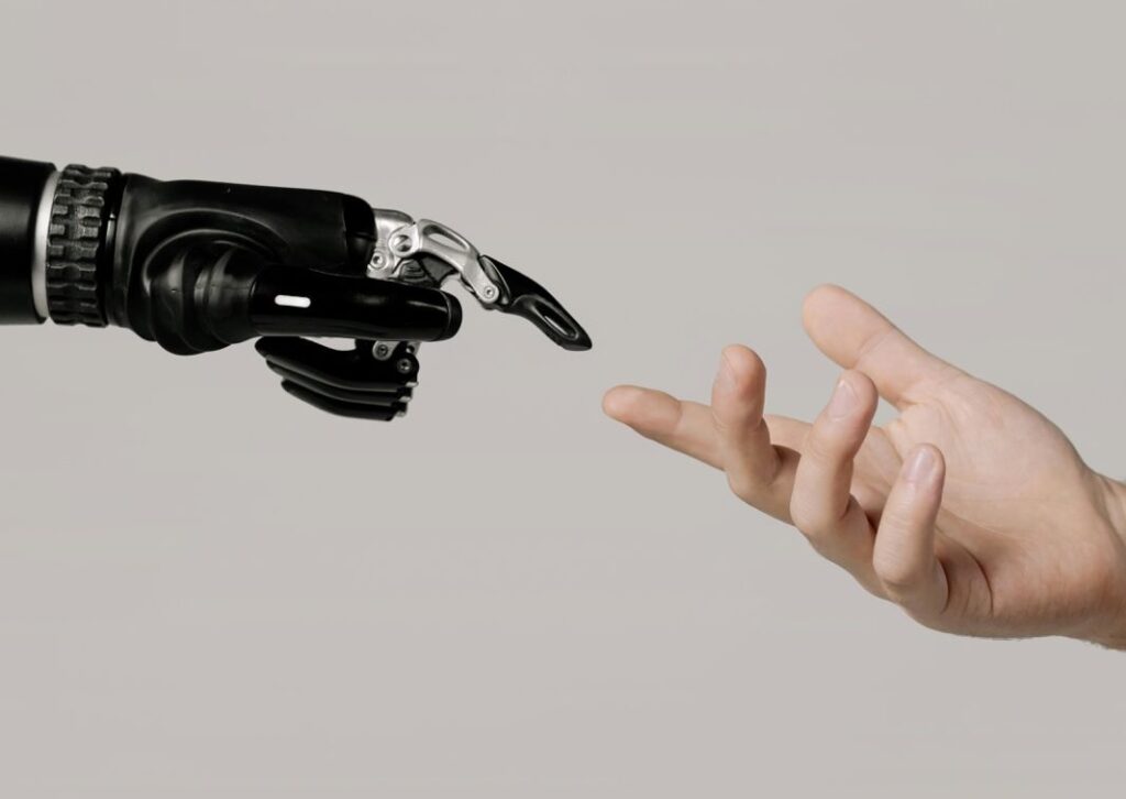 Image of AI and human finger reaching for each